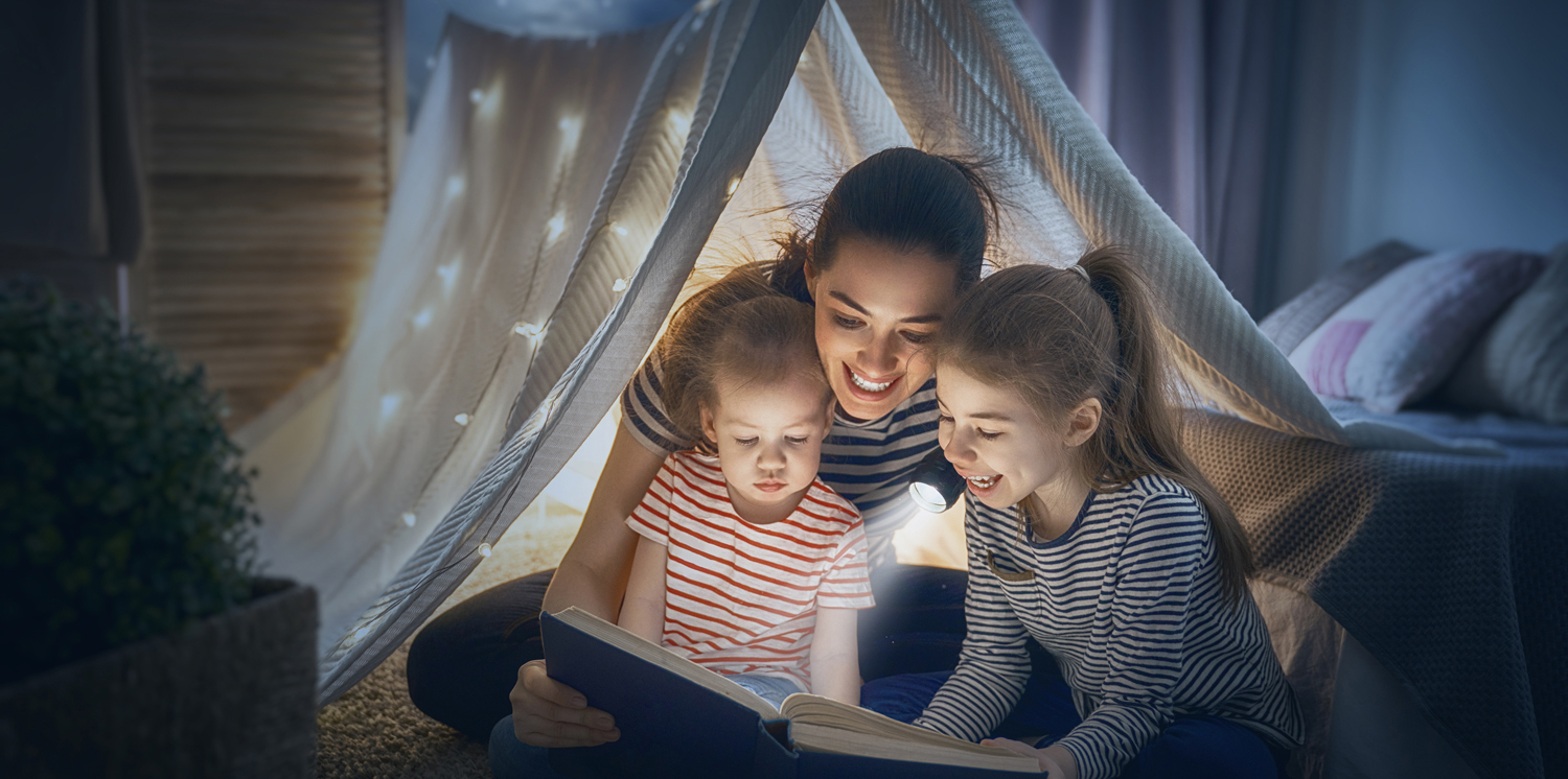Mom and children reading book