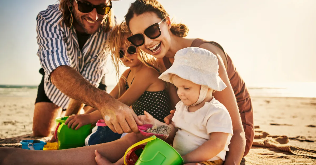 family-playing-in-sand